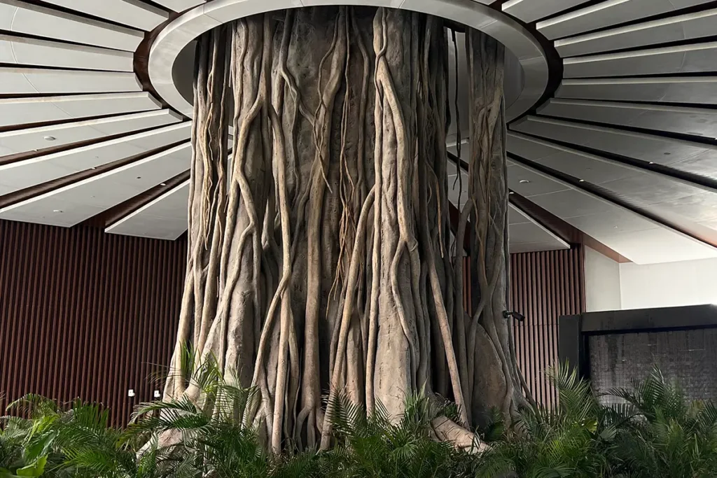 A majestic tree welcomes guests to the center of the porch