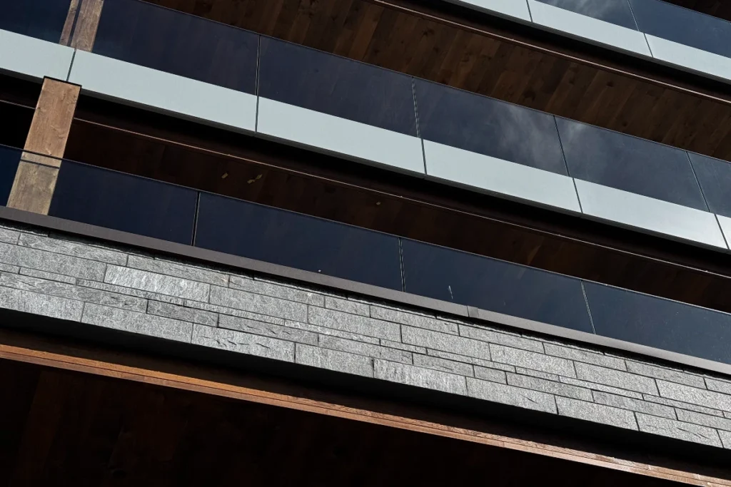 Rough-hewn wood paneling nods to traditional chalet construction